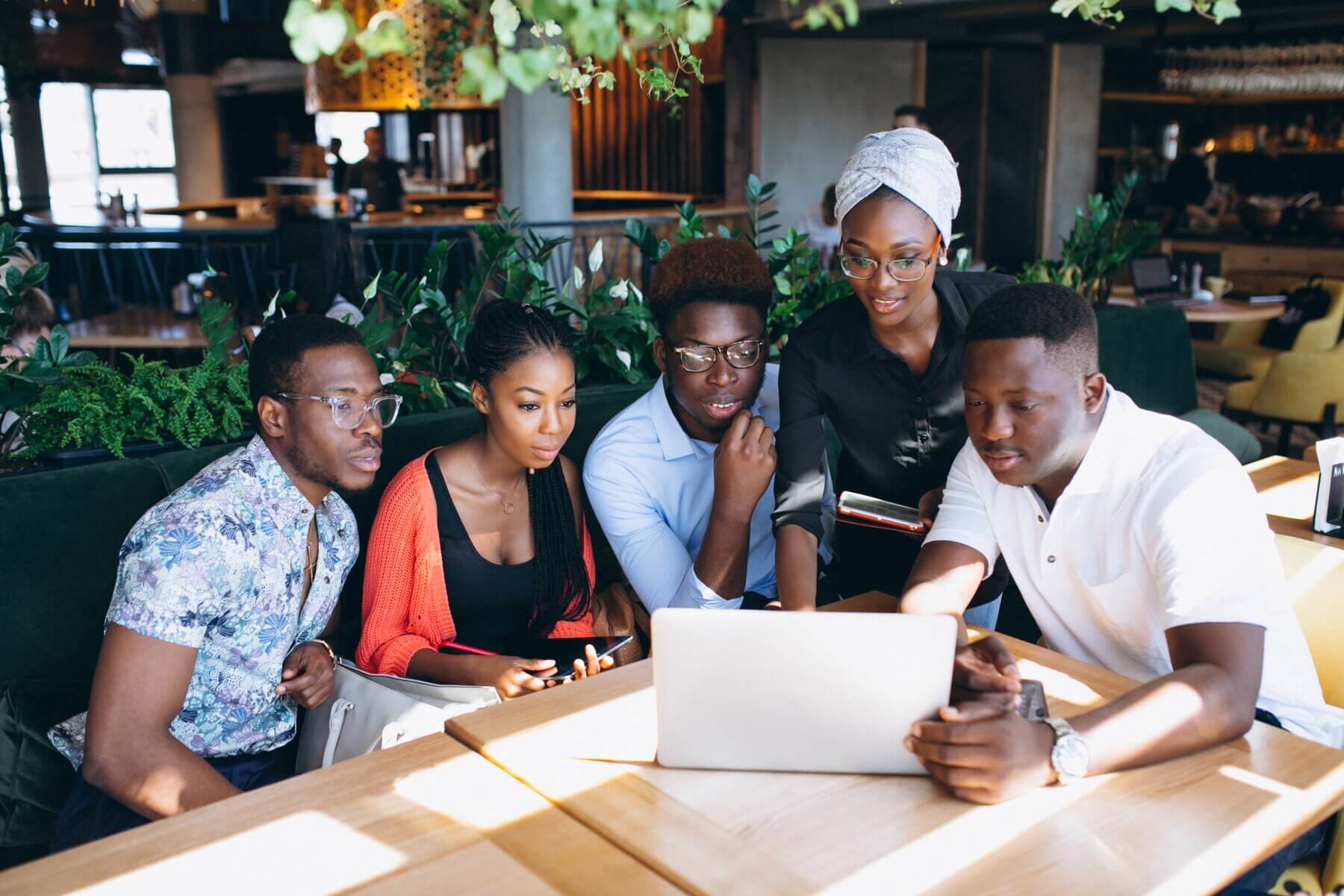 Team working together in an office environment, representing collaboration and innovation